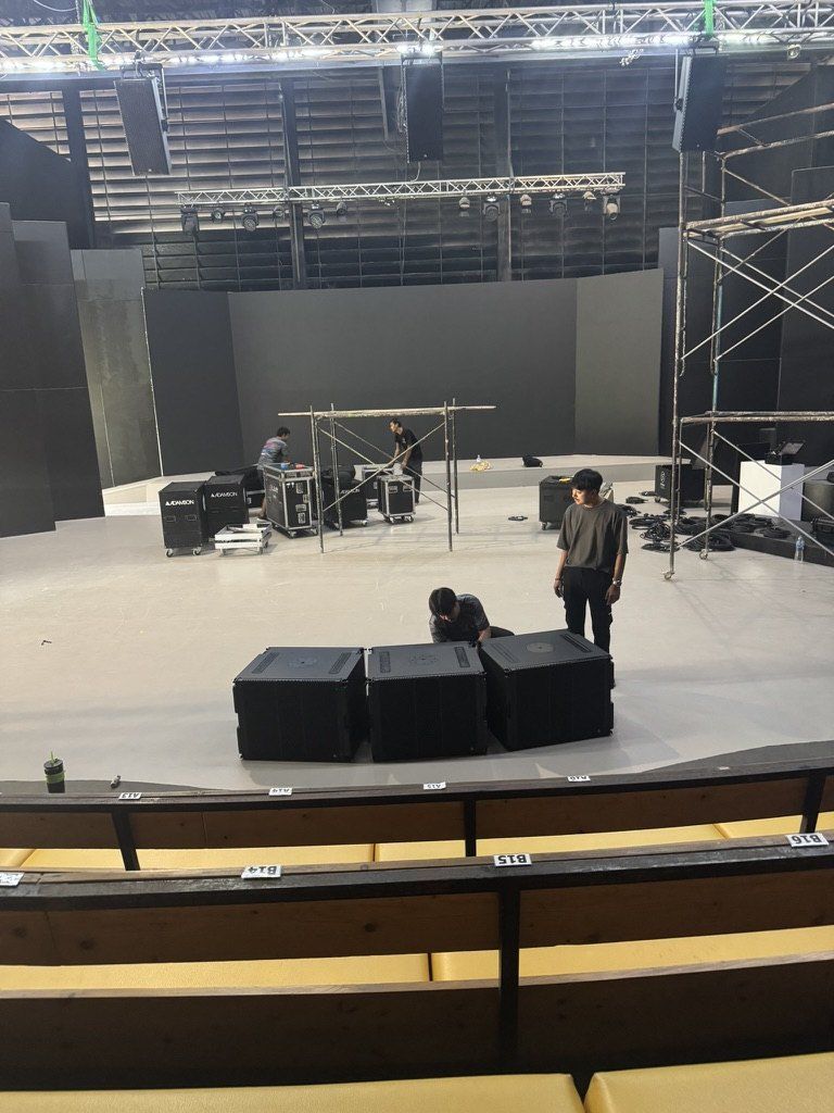 A stage during the installation of an immersive sound system