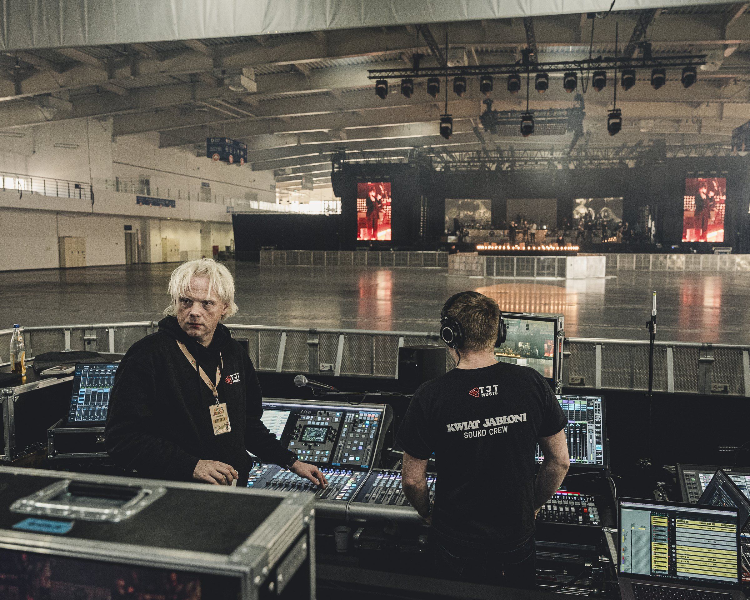 Engineers at the consoles while setting up for an arena show